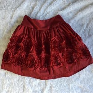Rosy red skirt with flowers - satin like material